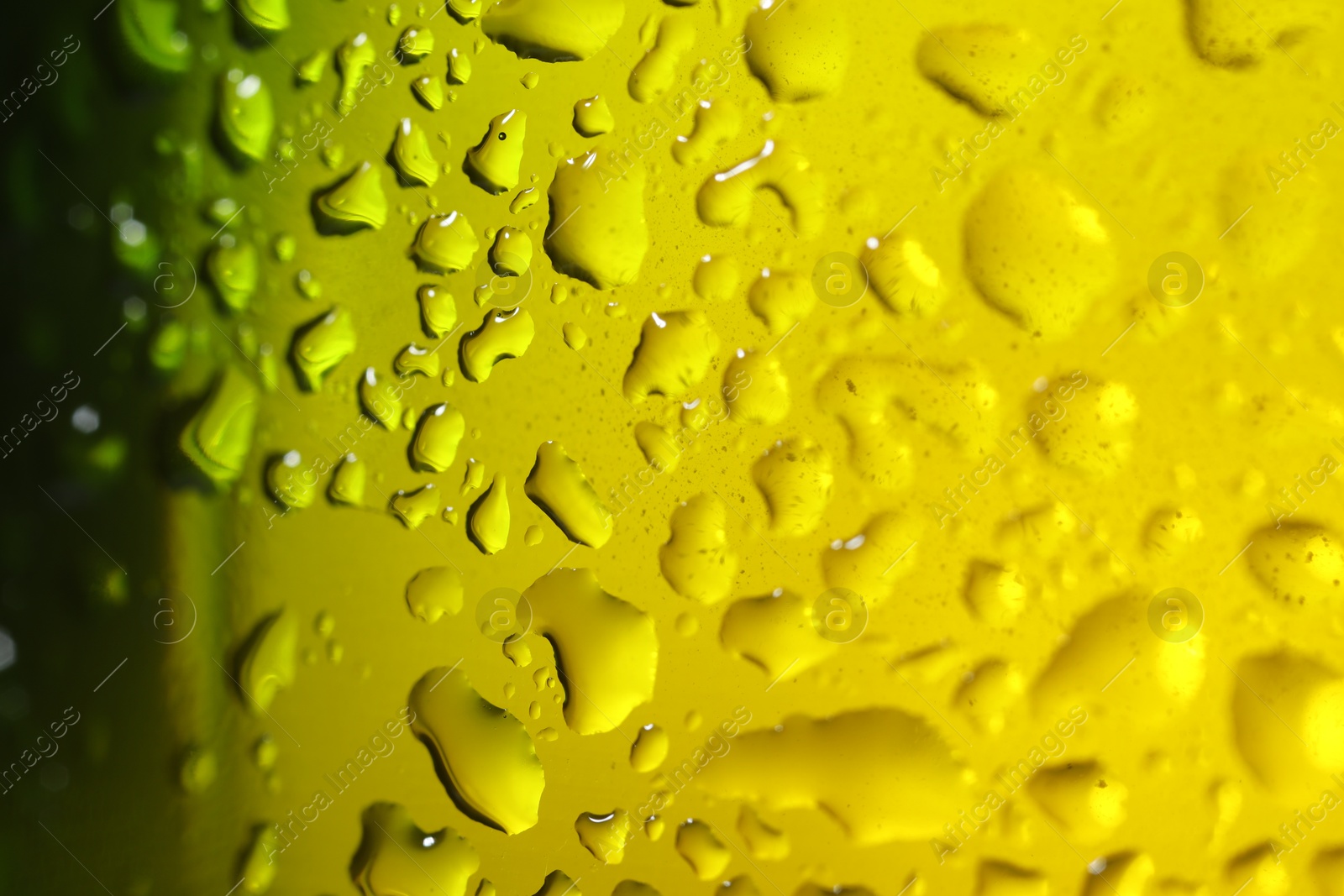 Photo of Water drops on color glass surface, macro view