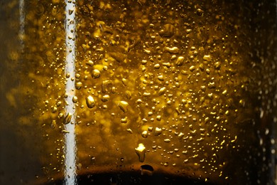 Glass bottle with condensation drops, macro view