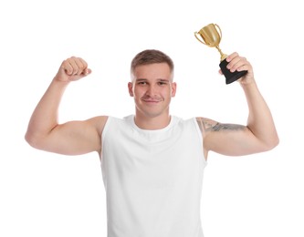 Photo of Smiling winner with golden trophy cup showing his biceps on white background