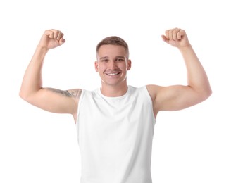 Photo of Happy winner showing his biceps on white background