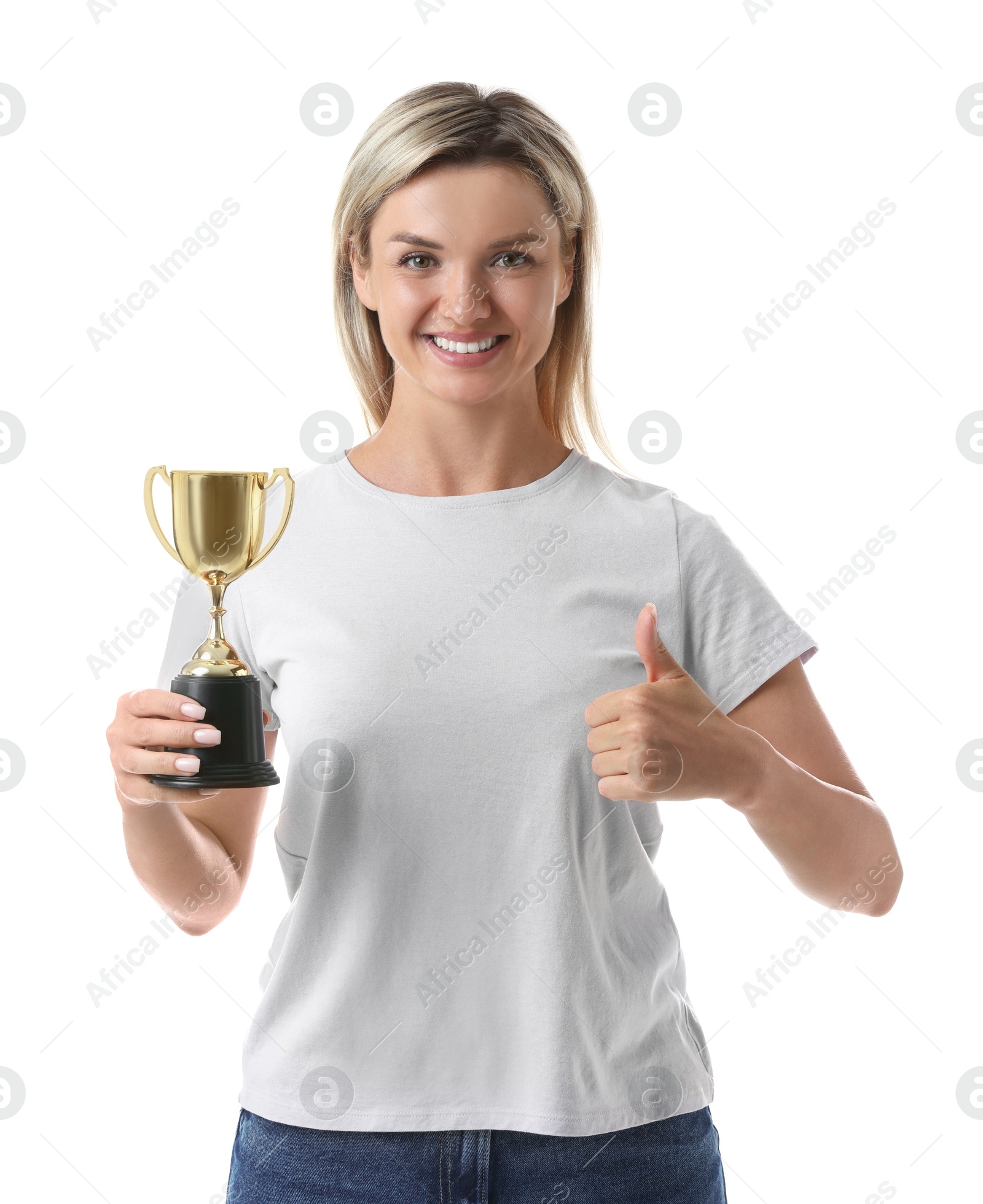 Photo of Happy winner with golden trophy cup showing thumbs up on white background