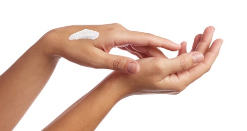 Photo of Woman applying cream onto hand on white background, closeup