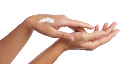 Photo of Woman applying cream onto hand on white background, closeup