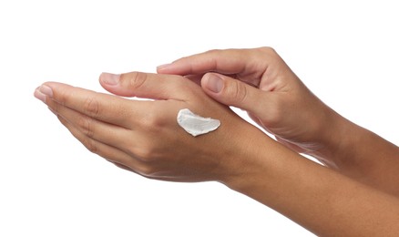 Photo of Woman applying cream onto hand on white background, closeup