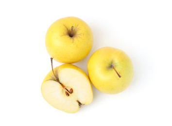 Whole and cut ripe yellow apples isolated on white, top view