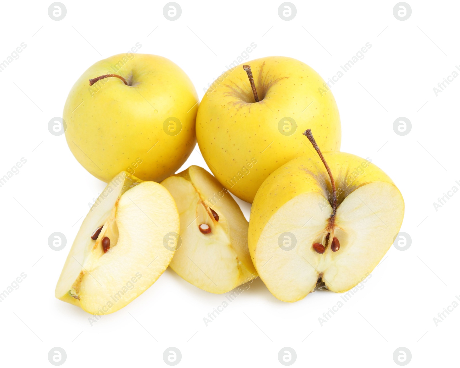 Photo of Whole and cut ripe yellow apples isolated on white