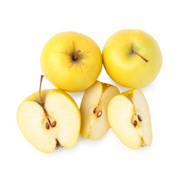 Photo of Whole and cut ripe yellow apples isolated on white, top view