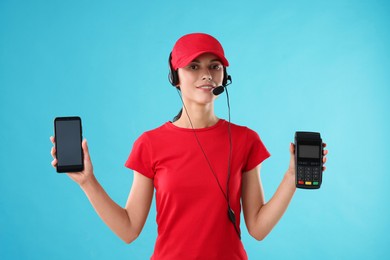 Photo of Fast-food worker smartphone and payment terminal on light blue background