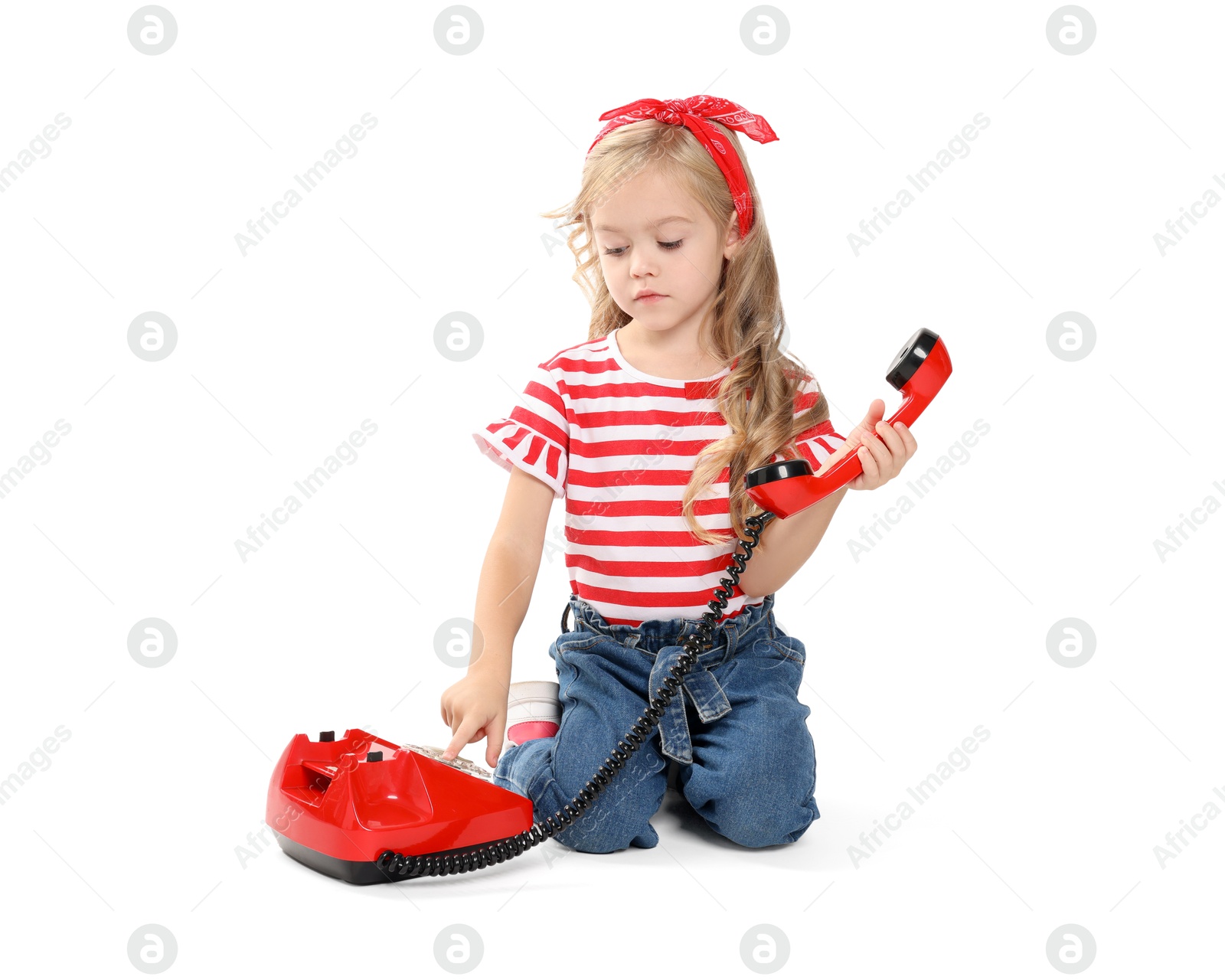 Photo of Cute little girl with telephone on white background