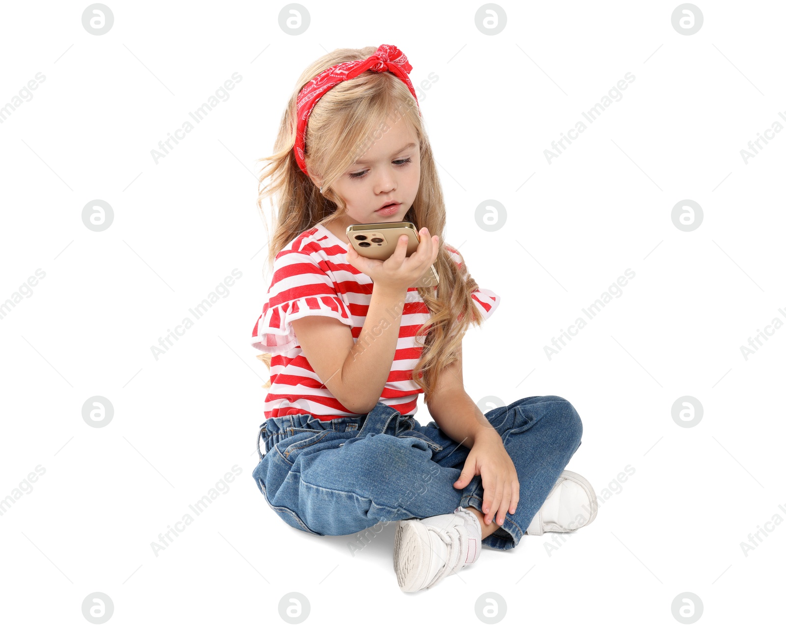 Photo of Cute little girl with smartphone on white background