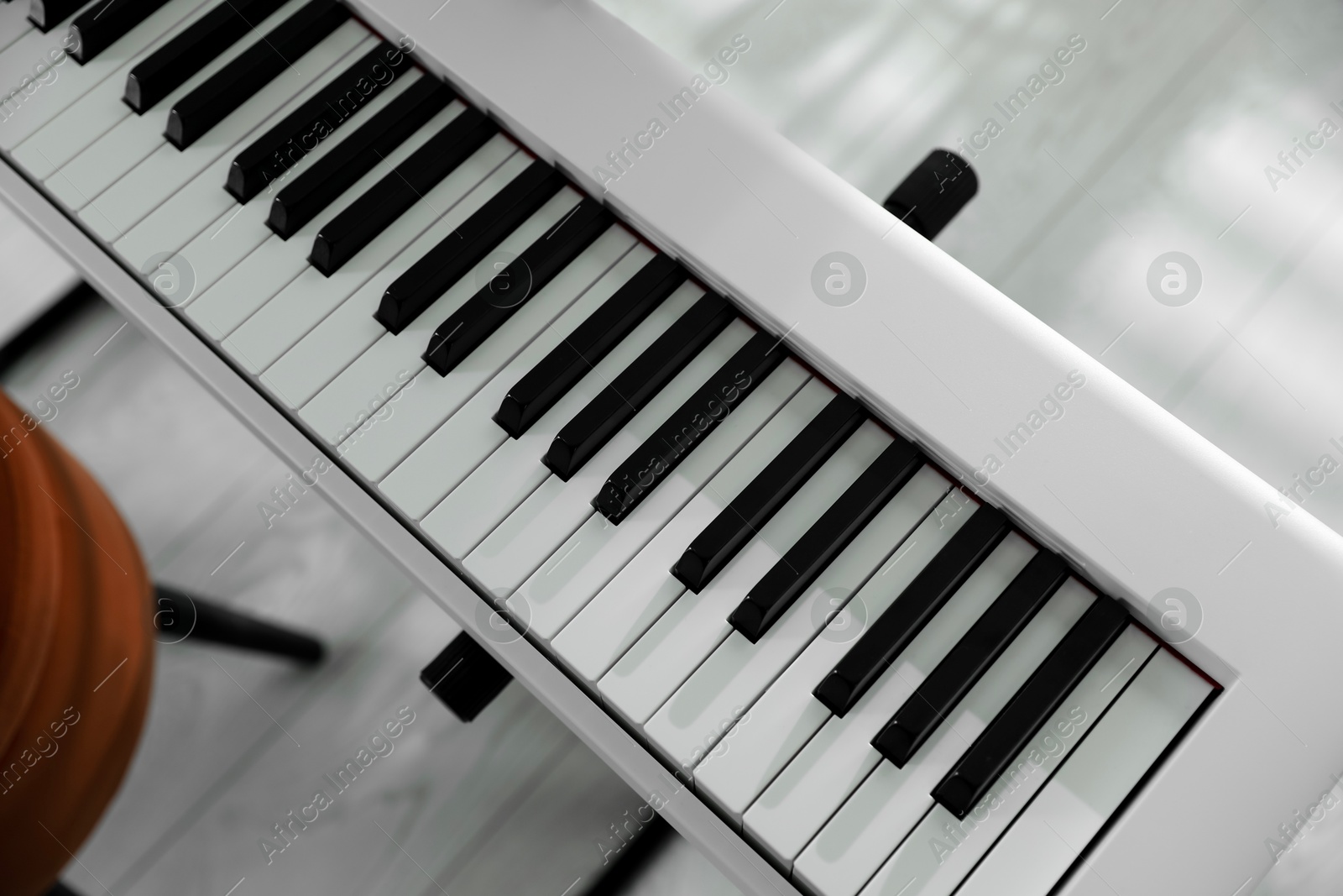 Photo of Synthesizer with black and white keys at home, above view