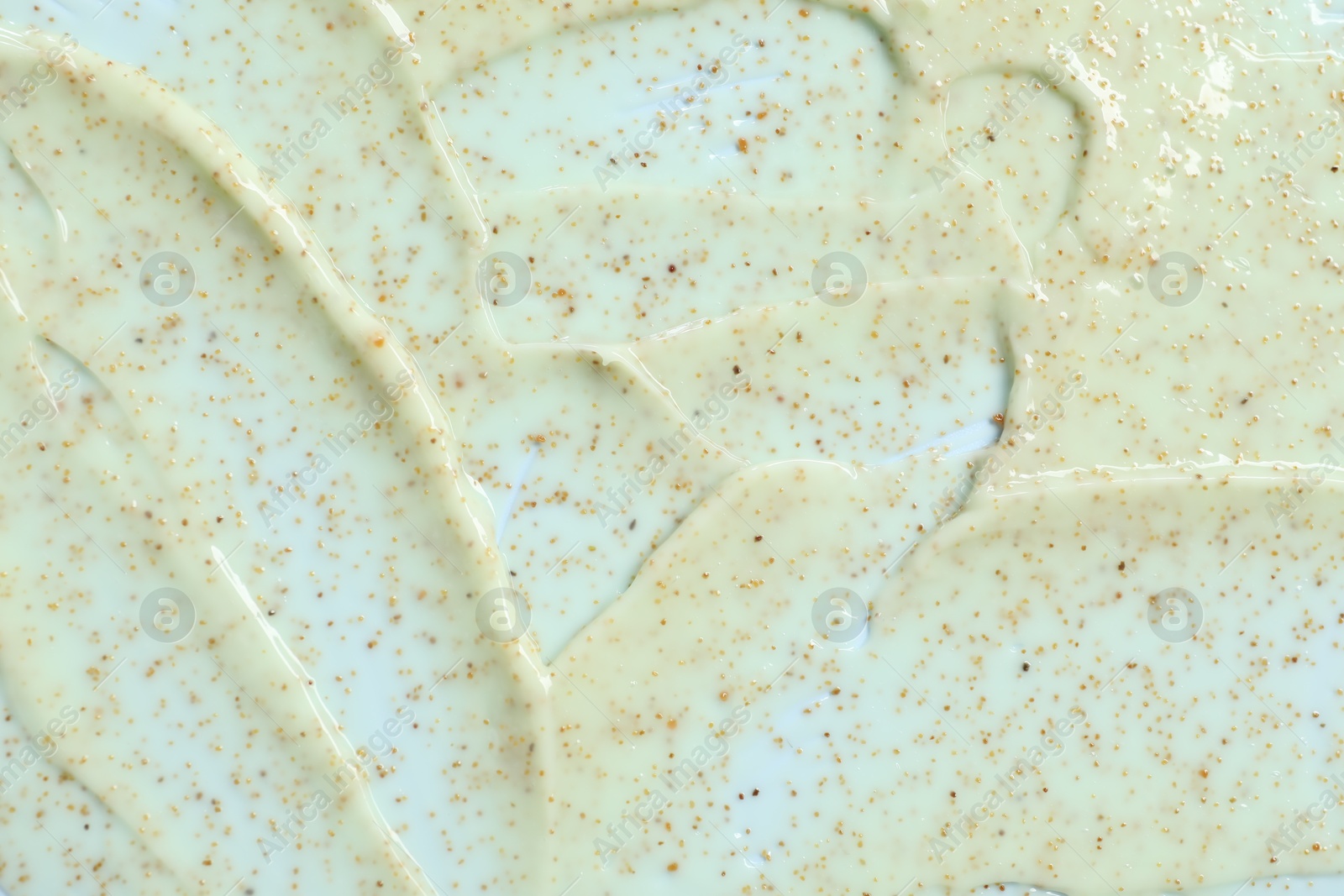 Photo of Sample of body scrub on light background, closeup