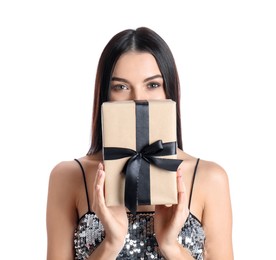 Photo of Woman in party dress holding Christmas gift on white background