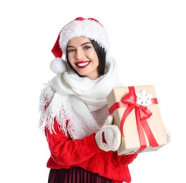 Photo of Woman in Santa hat, knitted mittens, scarf and red sweater holding Christmas gift on white background