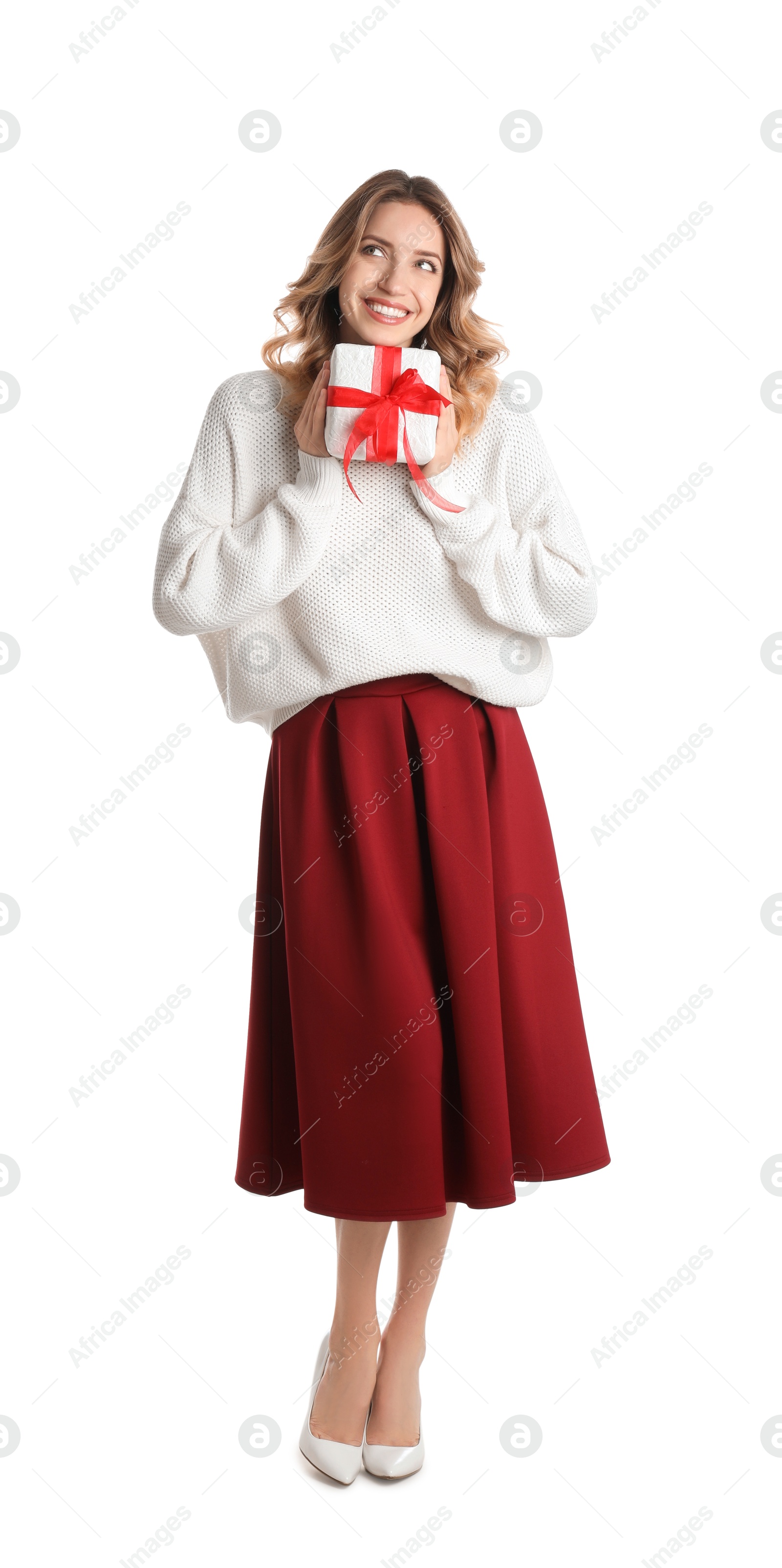 Photo of Beautiful young woman with Christmas present on white background