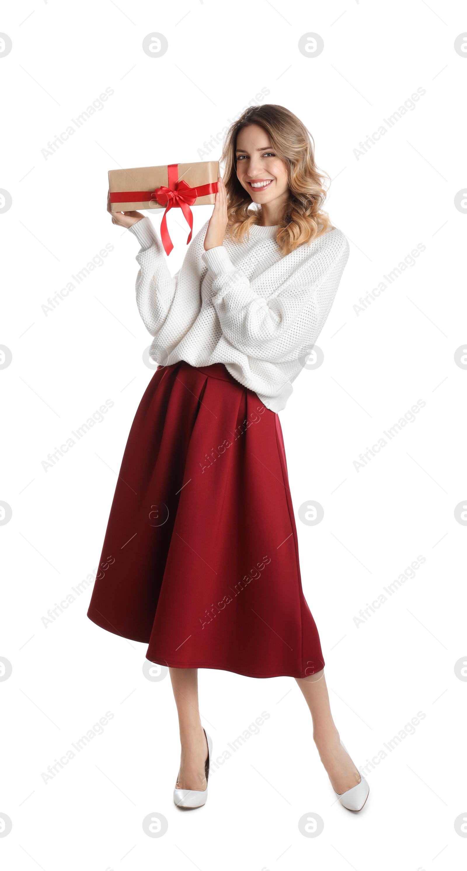 Photo of Beautiful young woman with Christmas present on white background