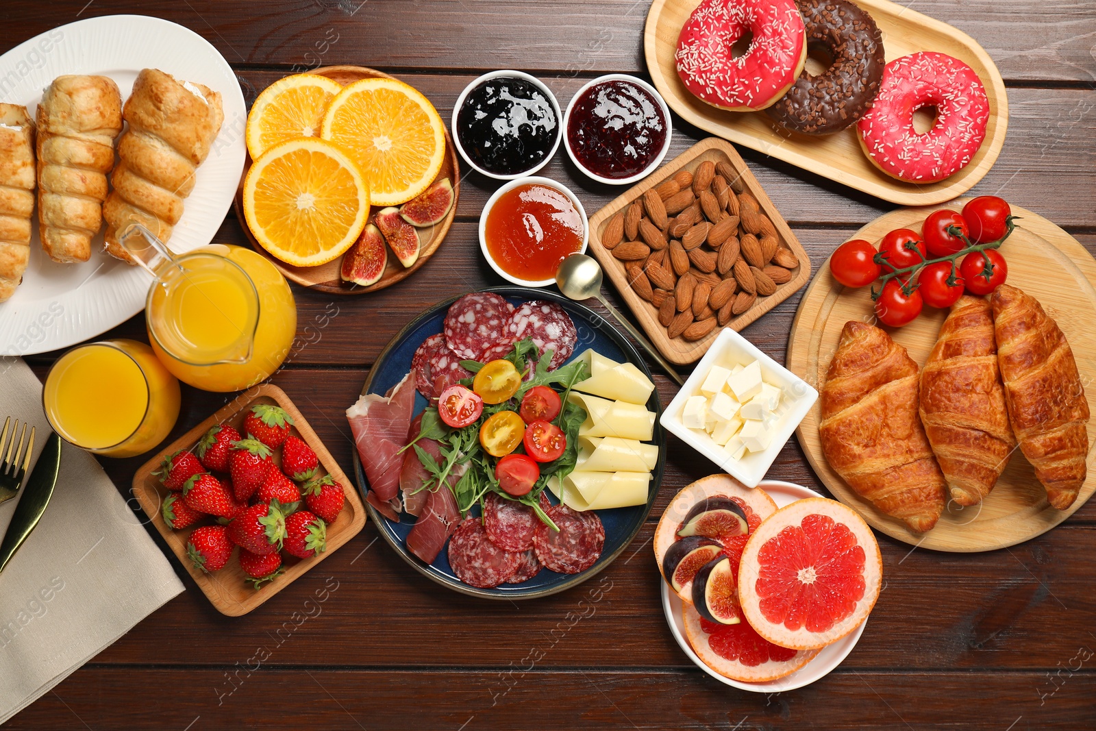 Photo of Different tasty food served for brunch on wooden table, flat lay