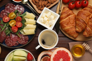 Photo of Different tasty food served for brunch on wooden table, flat lay