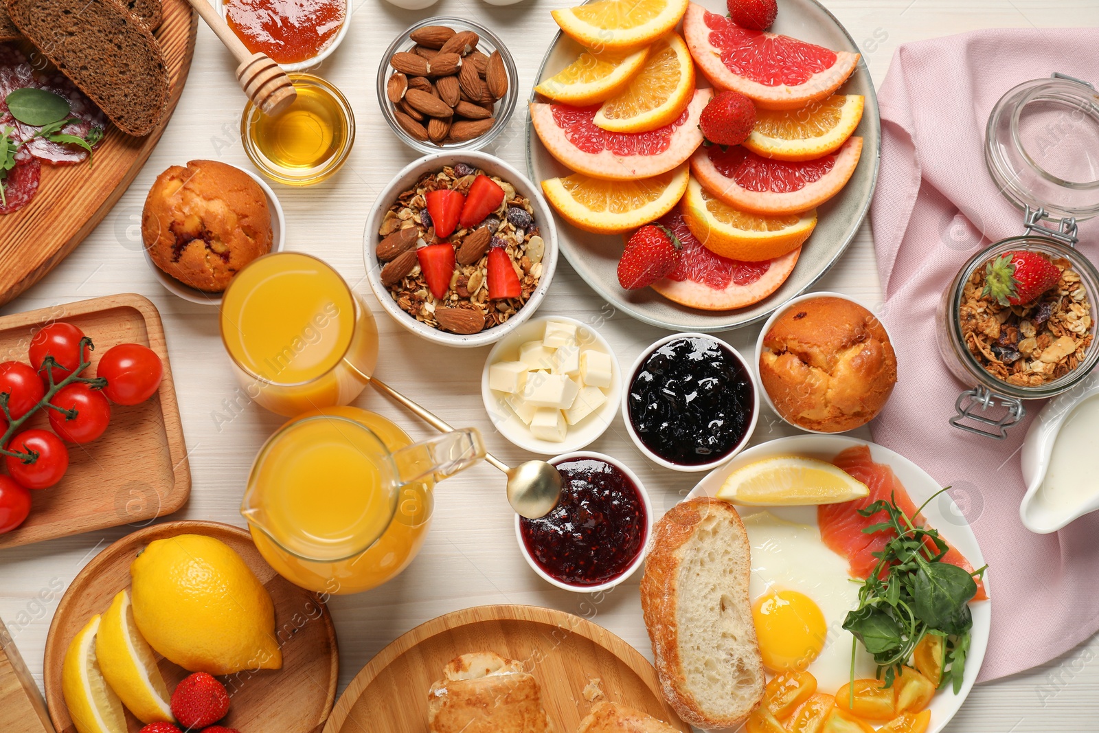 Photo of Different tasty food served for brunch on white wooden table, flat lay