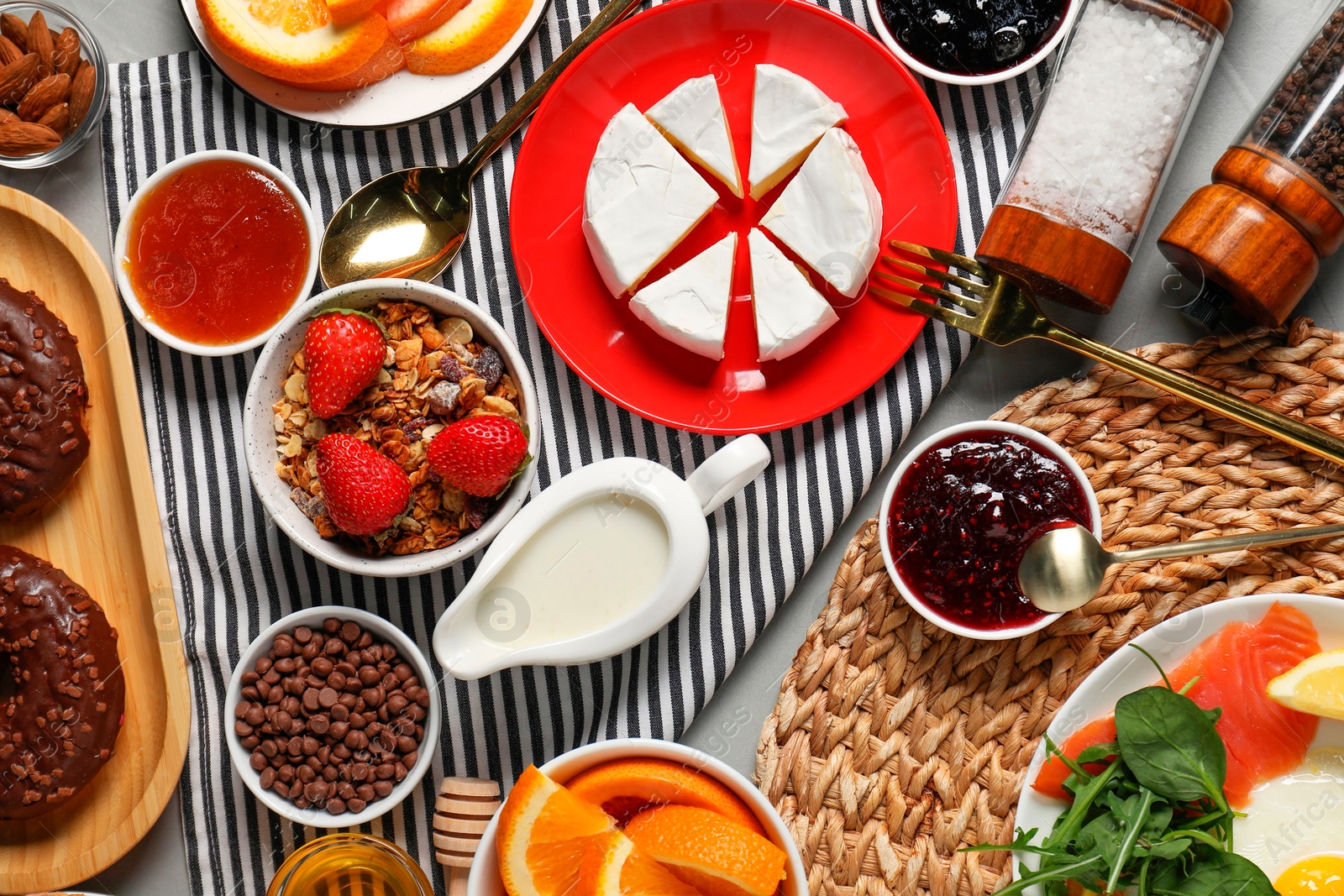 Photo of Different tasty food served for brunch on grey table, flat lay