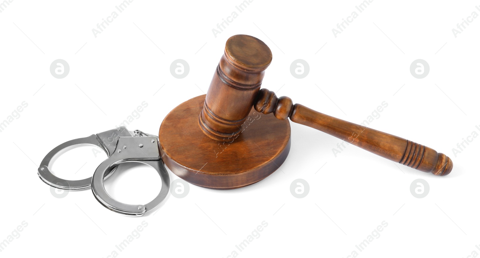 Photo of Handcuffs and judge's gavel isolated on white