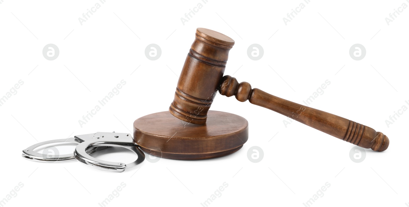 Photo of Handcuffs and judge's gavel isolated on white