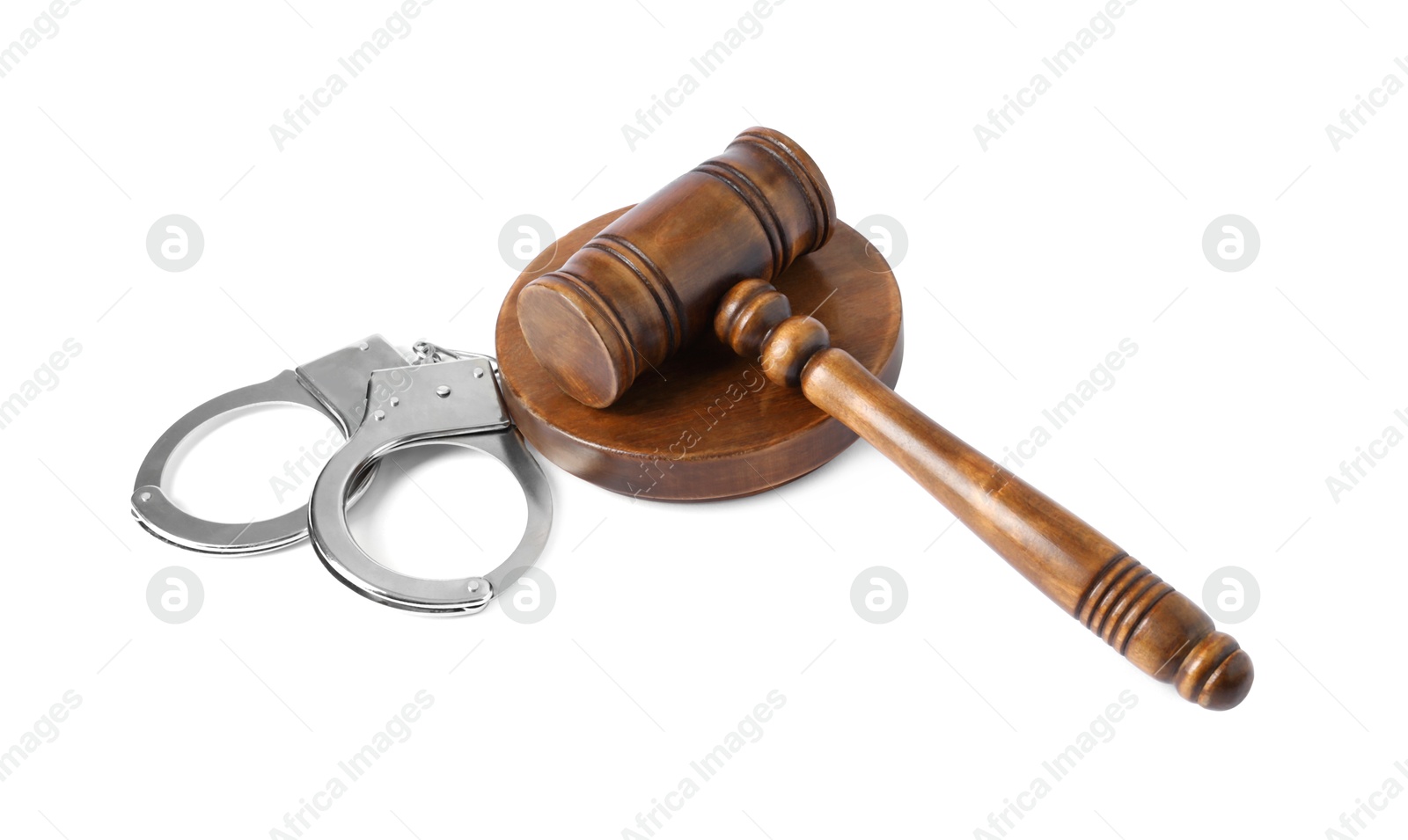 Photo of Handcuffs and judge's gavel isolated on white