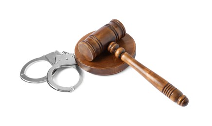 Photo of Handcuffs and judge's gavel isolated on white