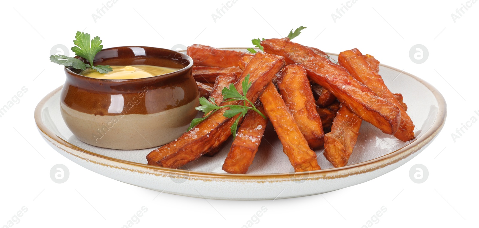 Photo of Delicious sweet potato fries, parsley and sauce isolated on white