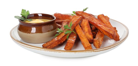 Photo of Delicious sweet potato fries, parsley and sauce isolated on white