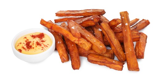 Photo of Delicious sweet potato fries and sauce isolated on white