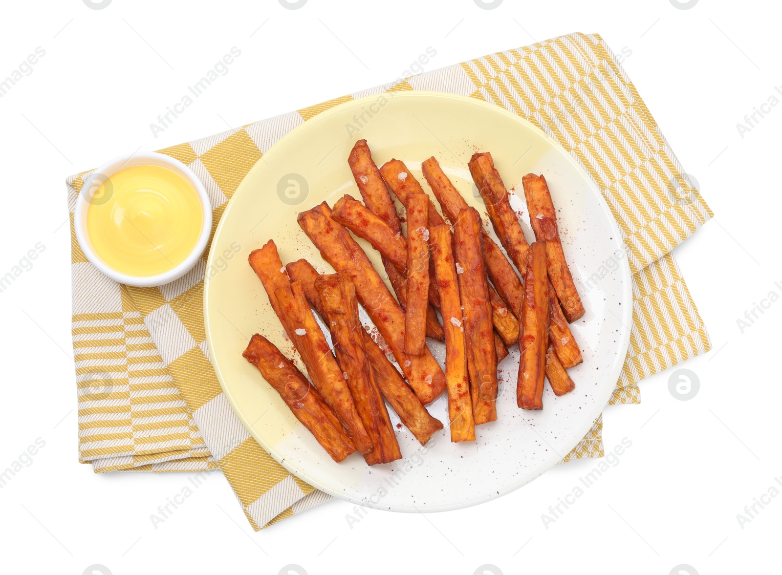 Photo of Delicious sweet potato fries and sauce isolated on white, top view