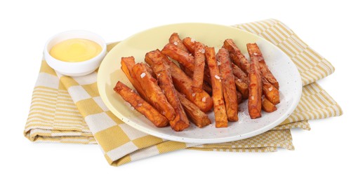 Photo of Delicious sweet potato fries and sauce isolated on white