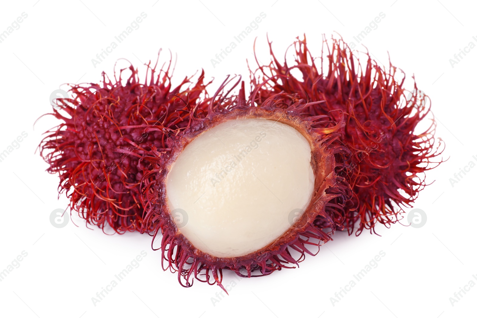 Photo of Delicious ripe rambutans isolated on white. Exotic fruit