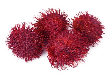 Photo of Delicious ripe rambutans isolated on white. Exotic fruit