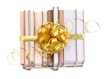 Photo of Books with golden bow as gift isolated on white