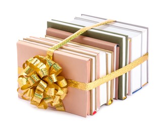 Photo of Books with golden bow as gift isolated on white