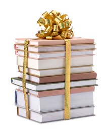 Photo of Stack of books with golden bow as gift isolated on white