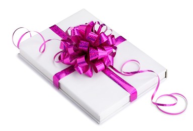 Photo of One book with purple bow as gift isolated on white