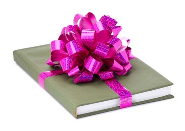 Photo of One book with purple bow as gift isolated on white