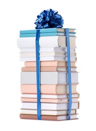 Photo of Stack of books with blue bow as gift isolated on white