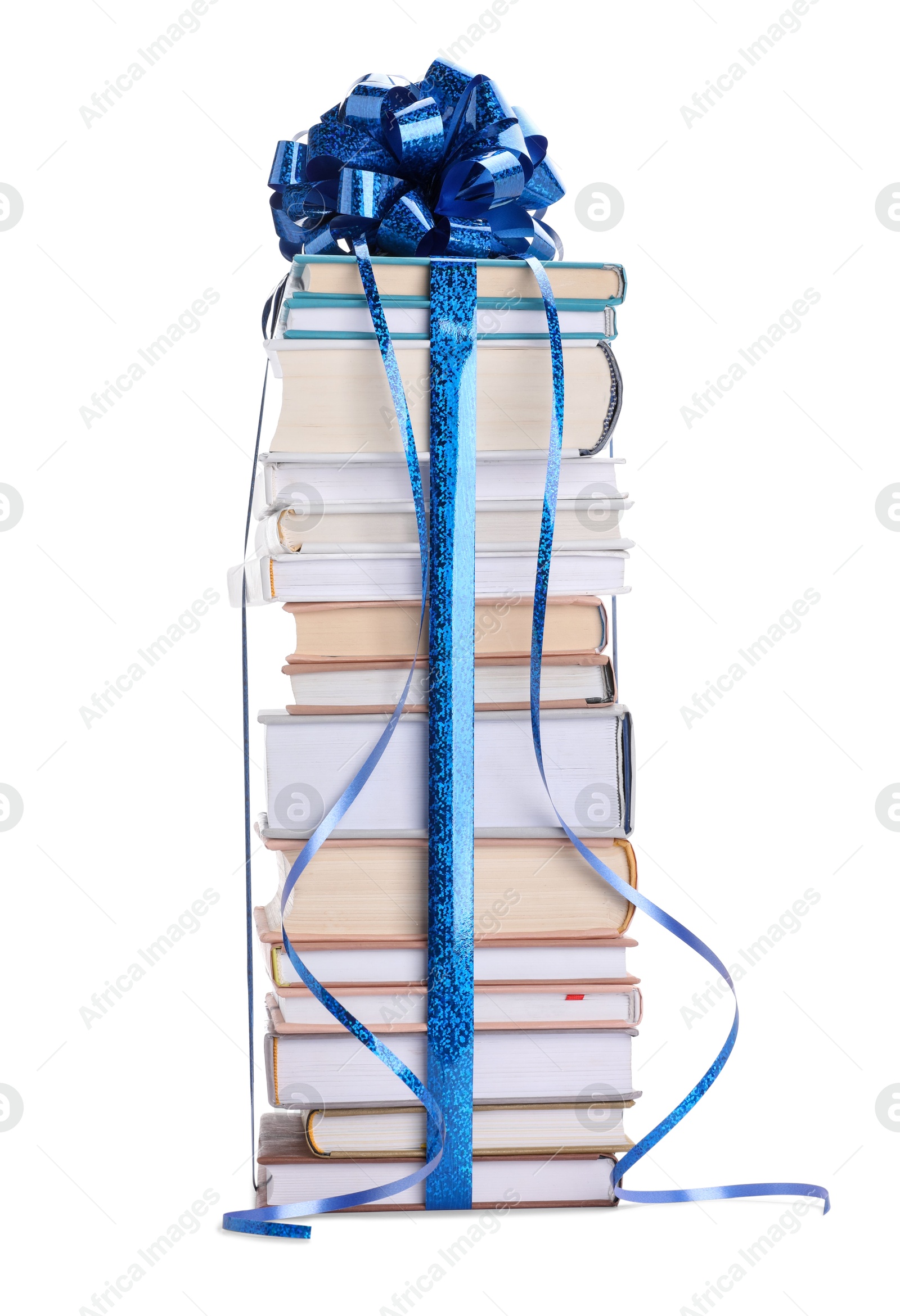 Photo of Stack of books with blue bow as gift isolated on white