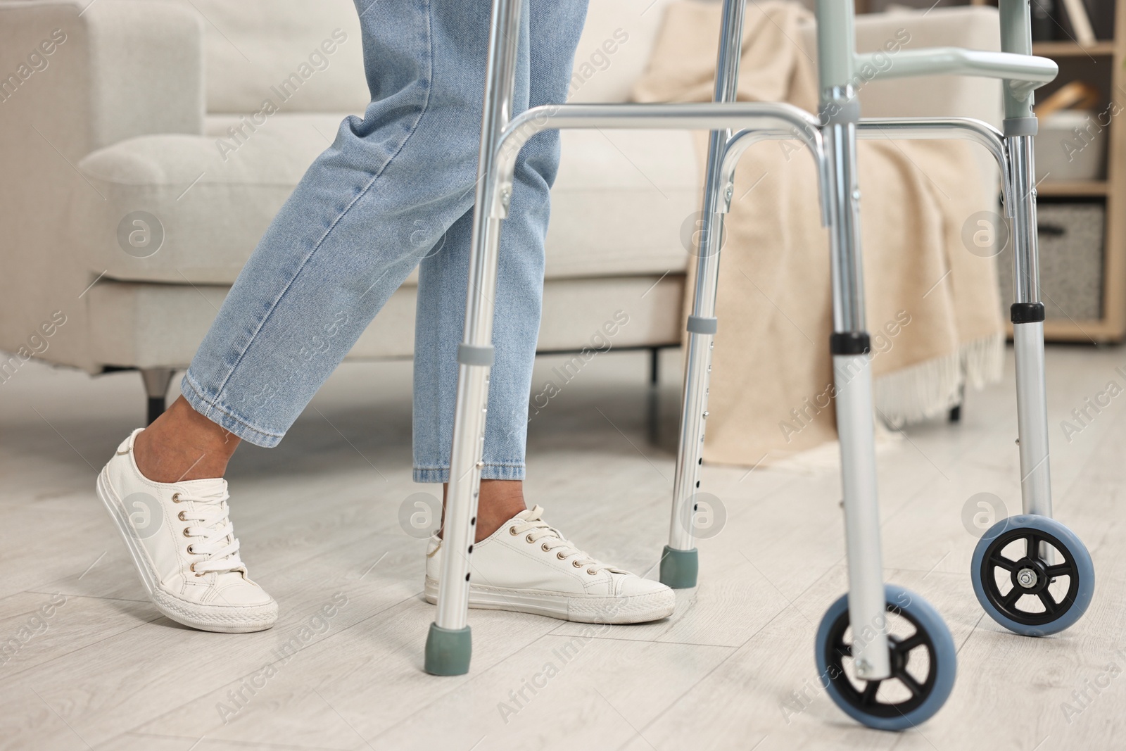 Photo of Senior woman with walking frame at home, closeup