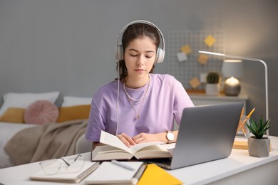 Student preparing for exam at table indoors