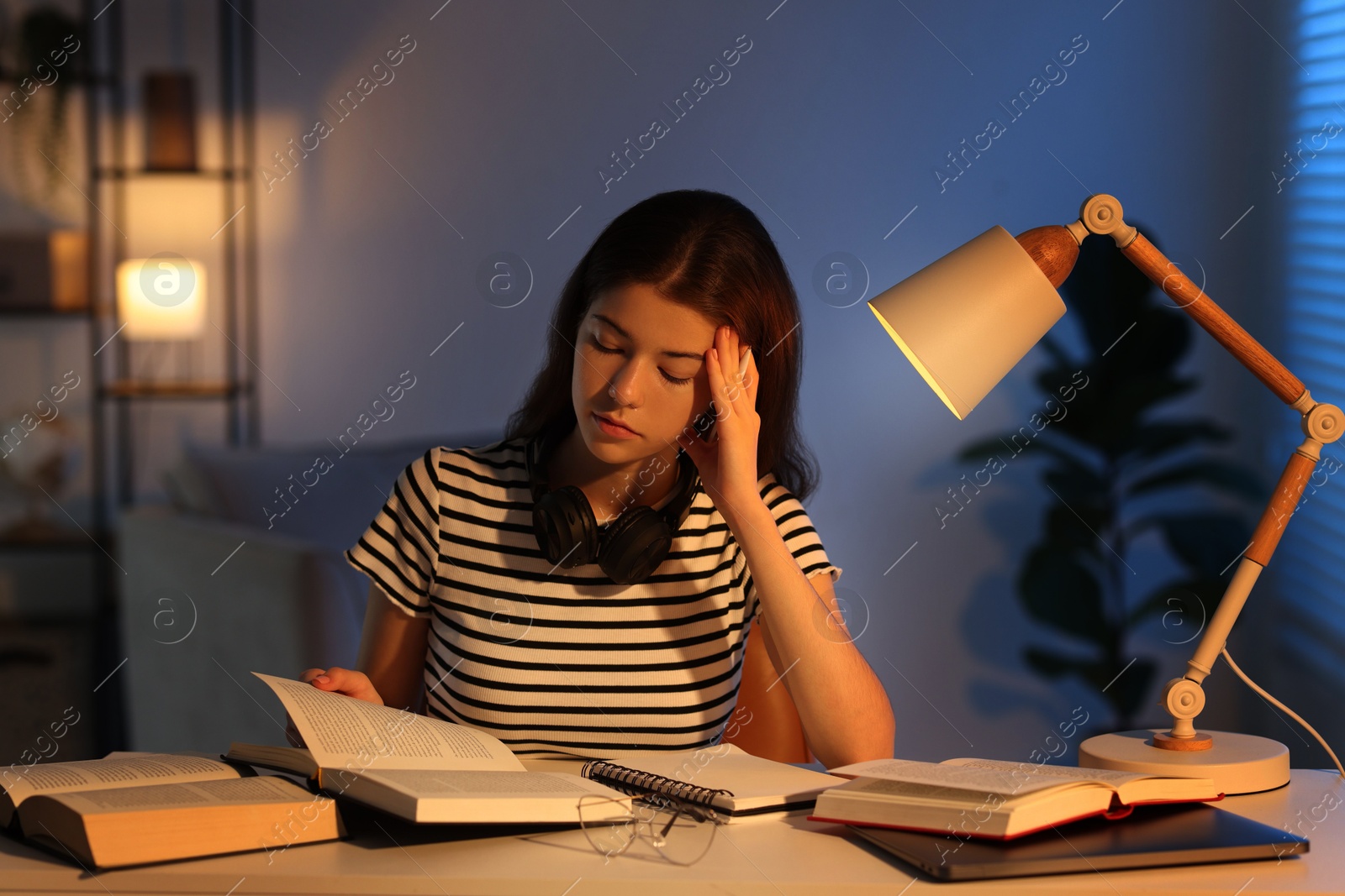 Photo of Student preparing for exam at table indoors