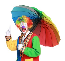 Photo of Happy clown with colorful umbrella on white background