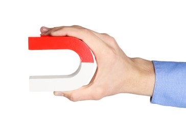 Photo of Man with horseshoe magnet on white background, closeup