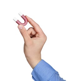 Photo of Man with horseshoe magnet on white background, closeup