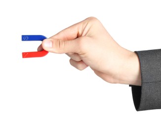 Photo of Man with horseshoe magnet on white background, closeup