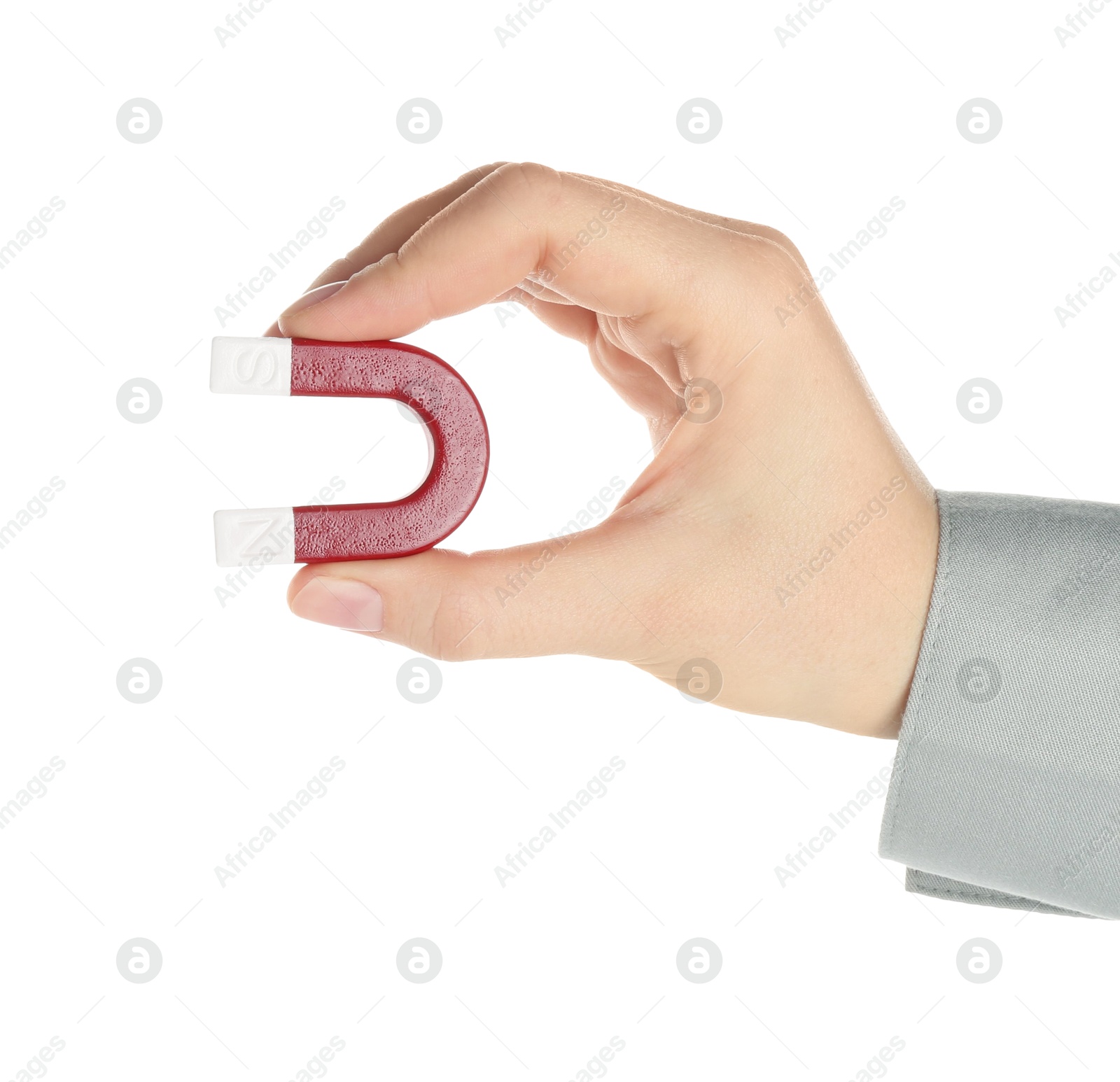 Photo of Woman with horseshoe magnet on white background, closeup